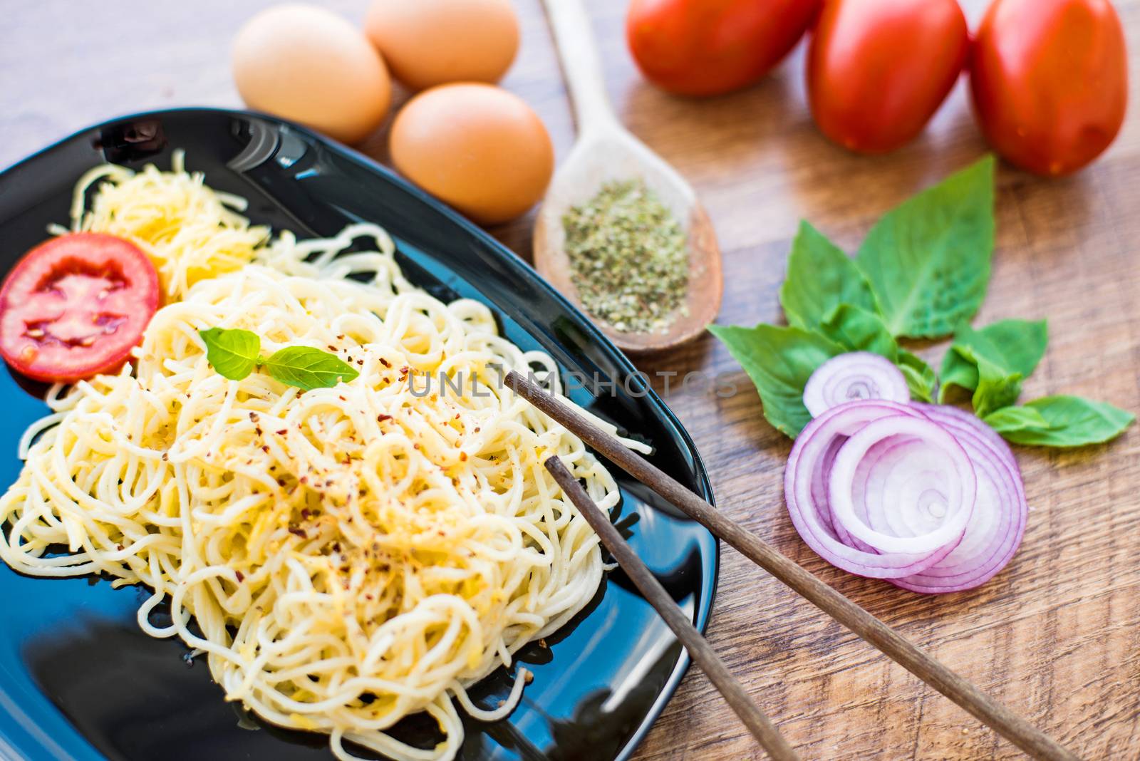 spaghetti dinner with sauce and vegetables close up