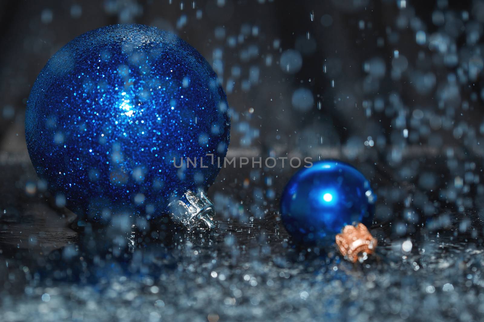 Close-up view of Christmas balls under the rain