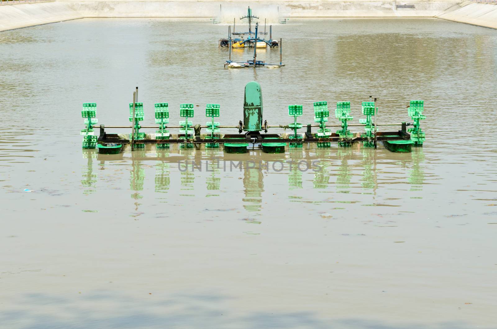 Pump adding oxygen to the water for wastewater treatment in small factories.