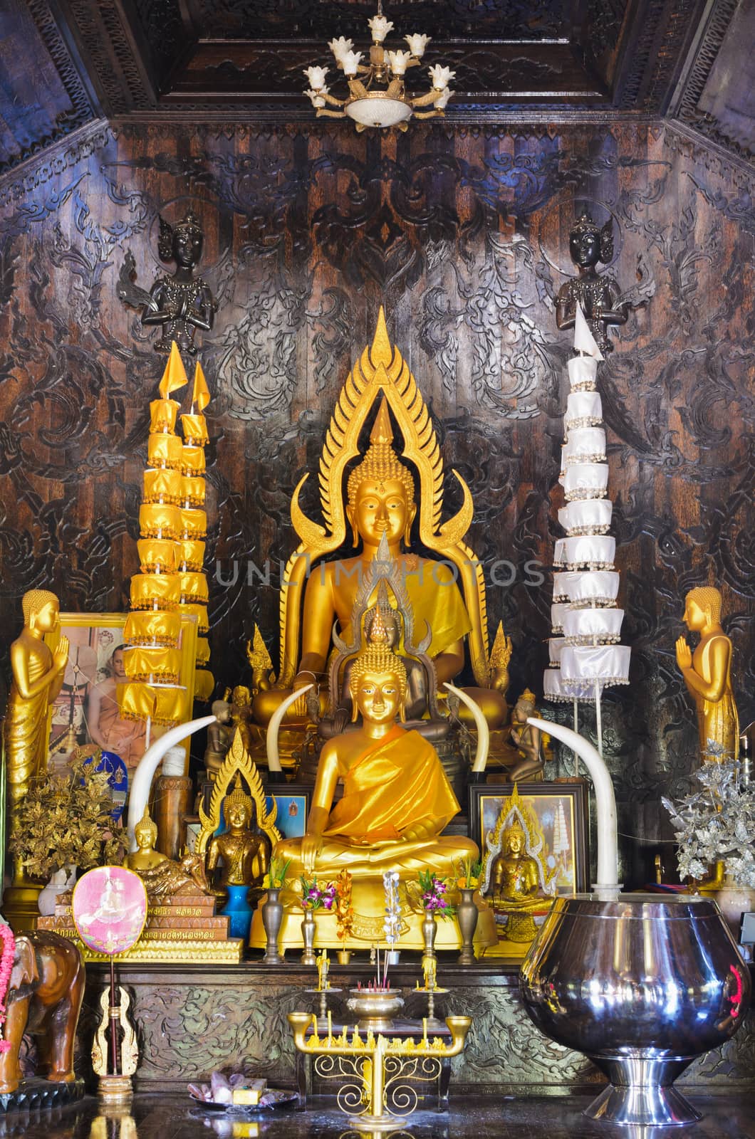 Buddha statue in chapel made of palm wood of Thailand
