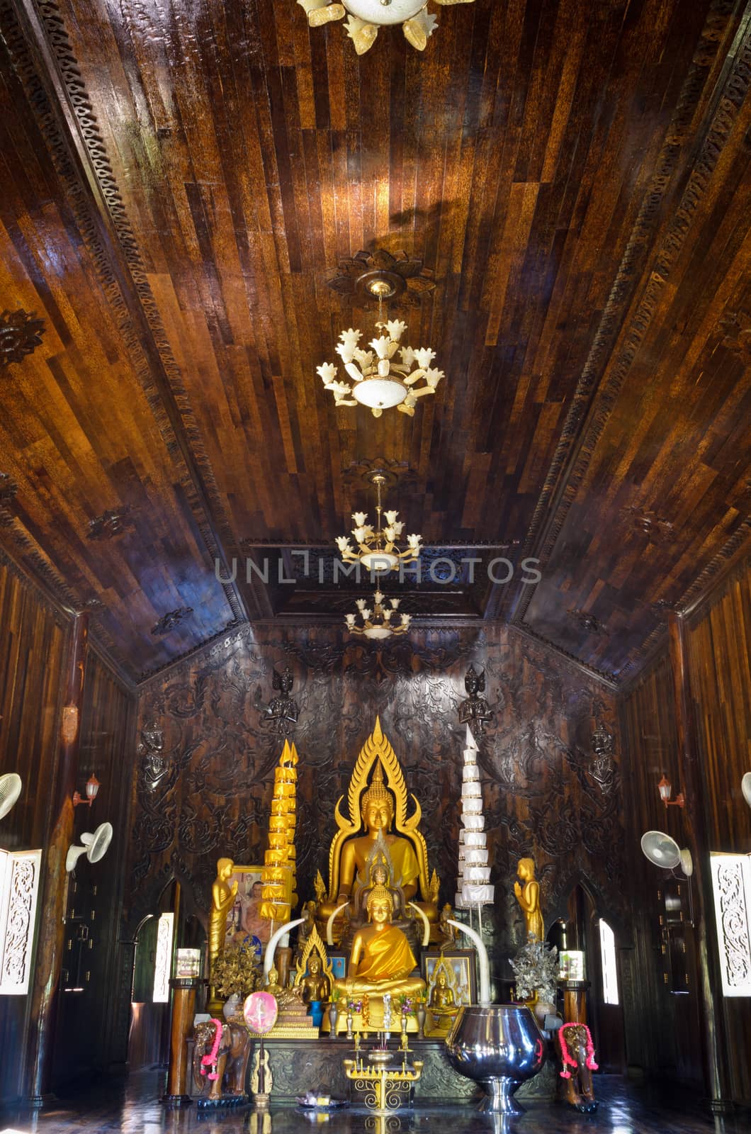 Buddha statue in chapel made of palm wood of Thailand
