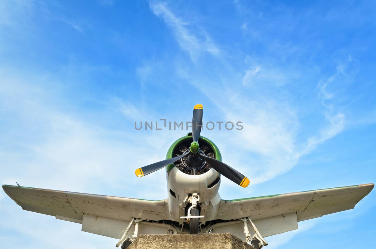 Old fighter aircraft used in world war 2 of Thailand on blue sky background
