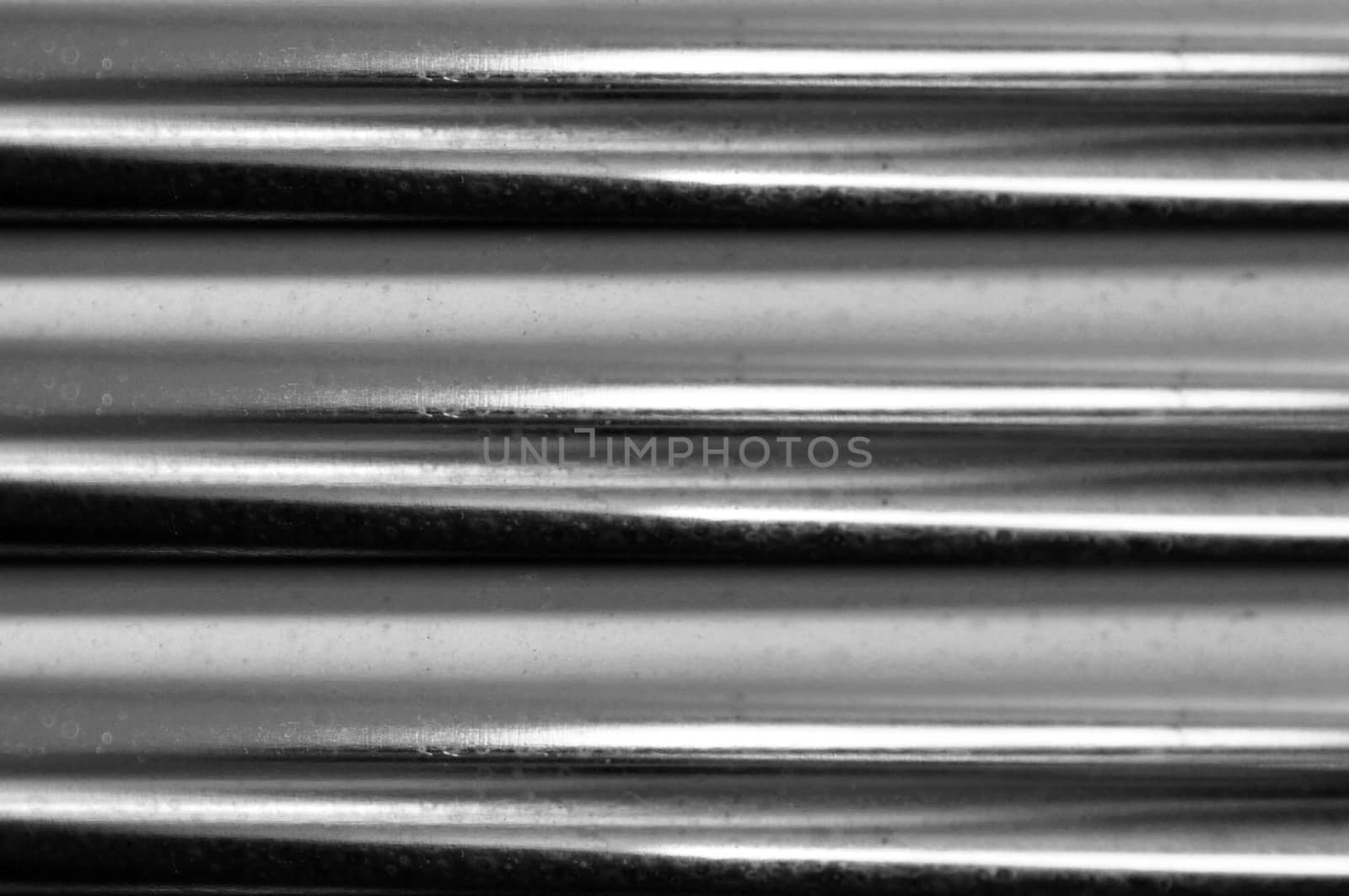 texture of steel tubes with reflections and impurities