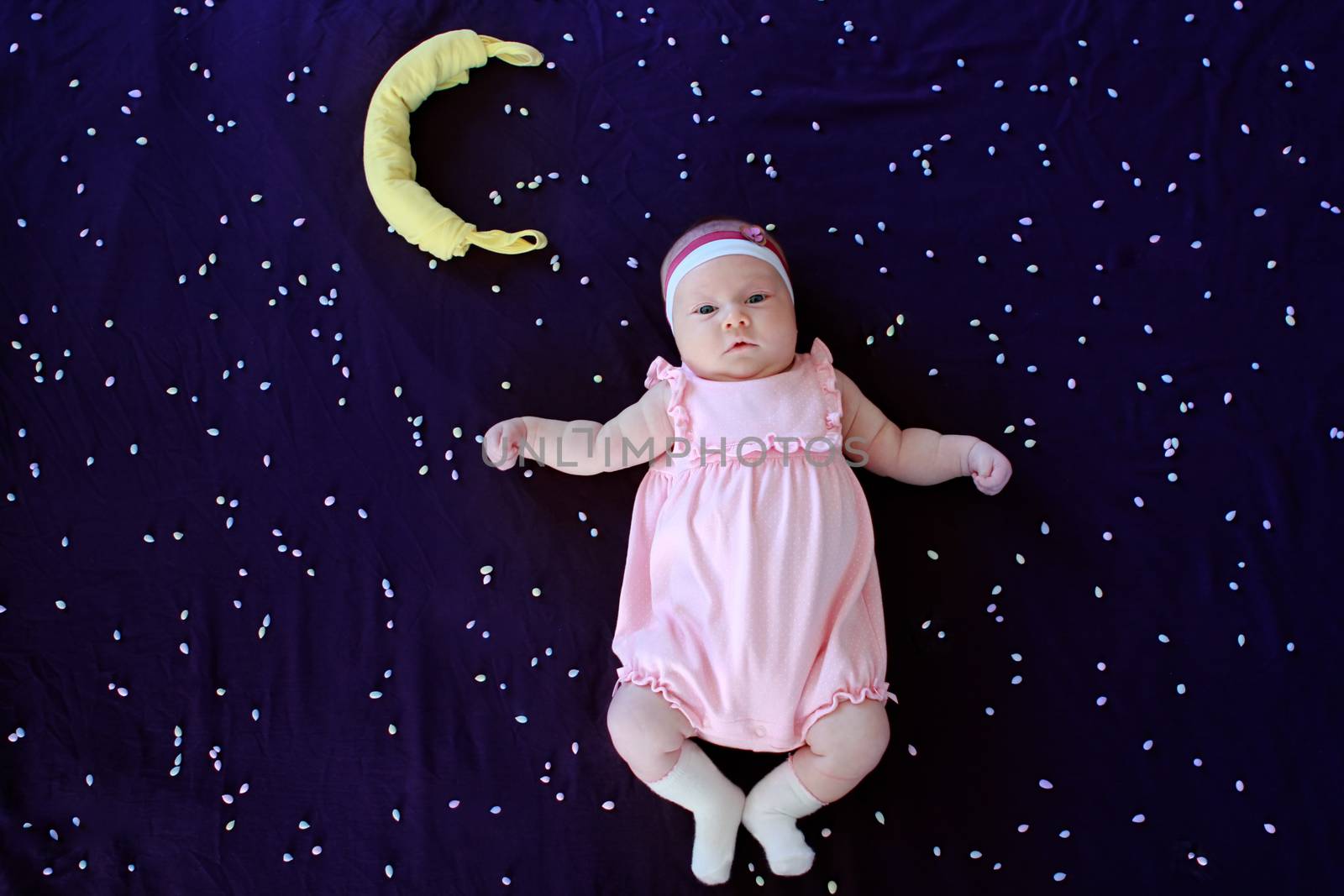 Beautiful small kid girl in pink dress