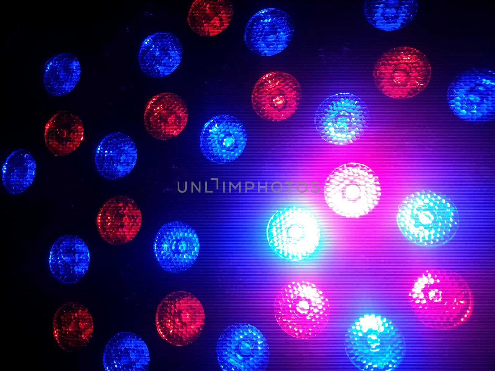 Red and blue bokeh lights in the dark .