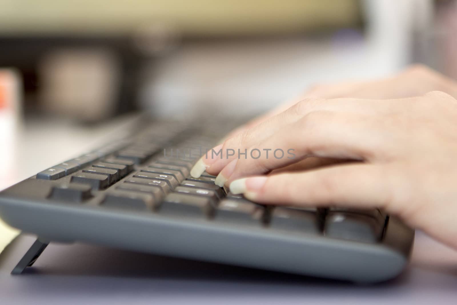 hands working on a keyboard black white 