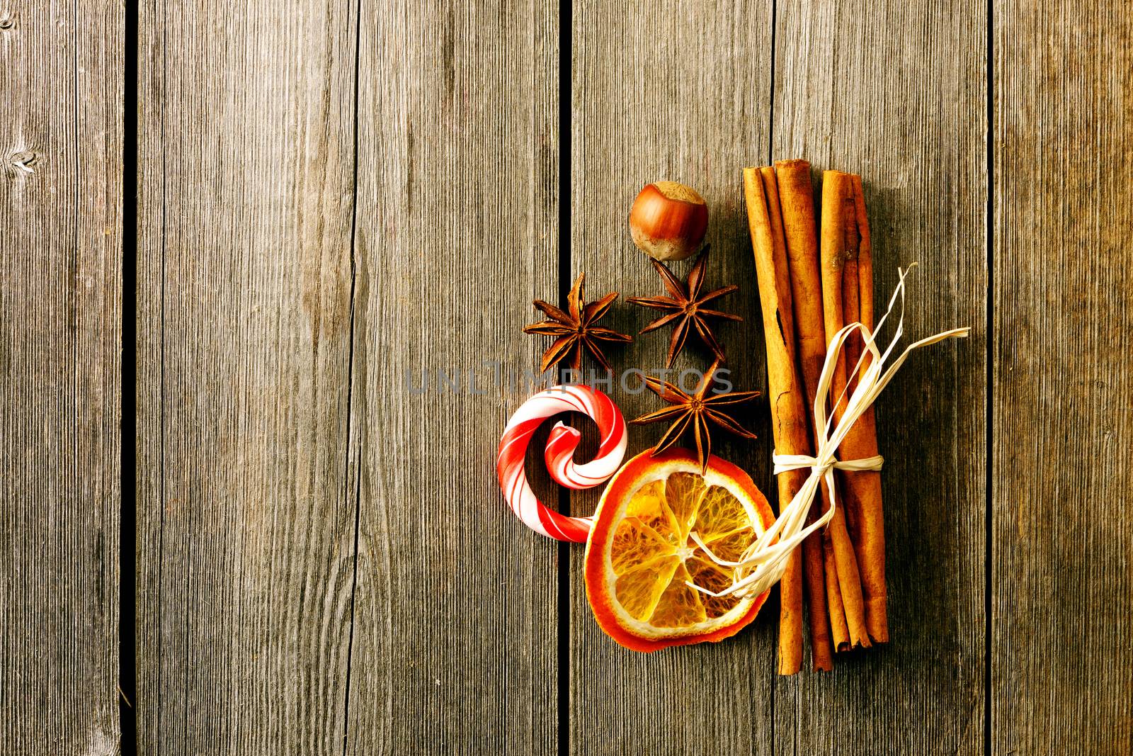 Cinnamon sticks over wooden table by haveseen