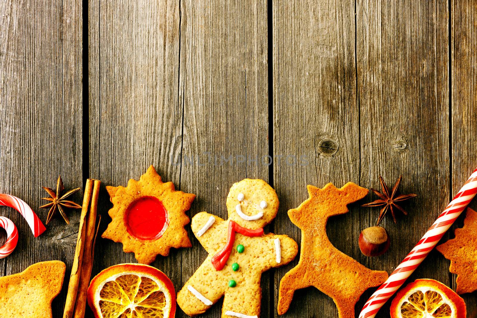 Christmas homemade gingerbread cookies over wooden table