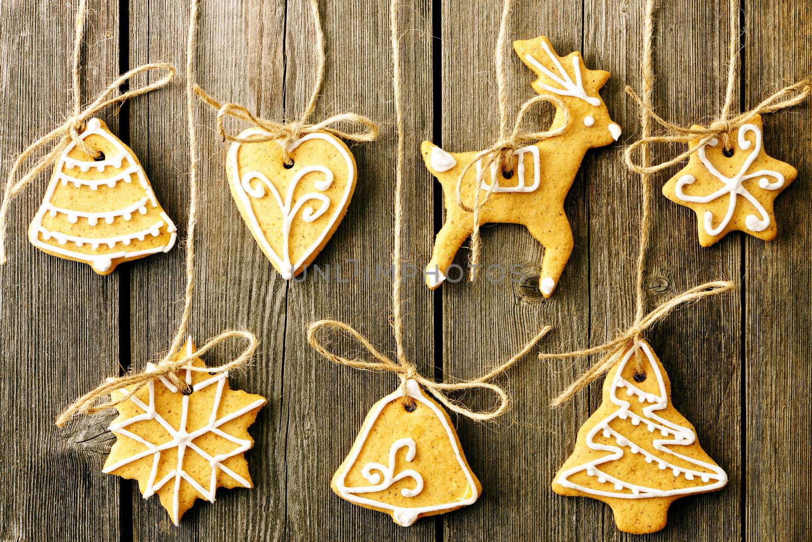 Christmas homemade gingerbread cookies over wooden table