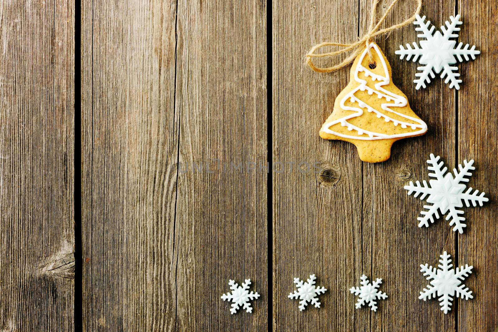 Christmas homemade gingerbread cookies over wooden table