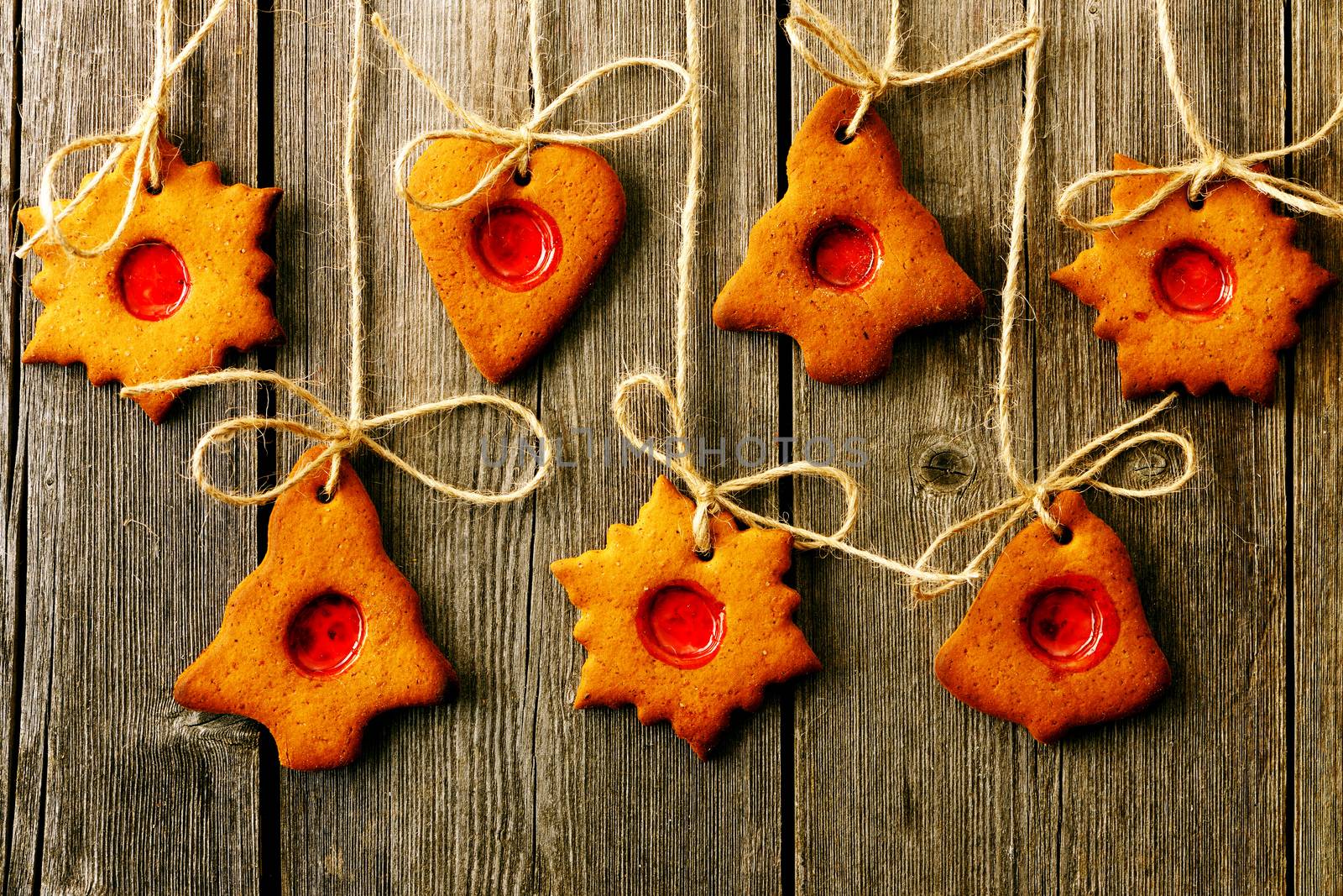 Christmas homemade gingerbread cookies over wooden table