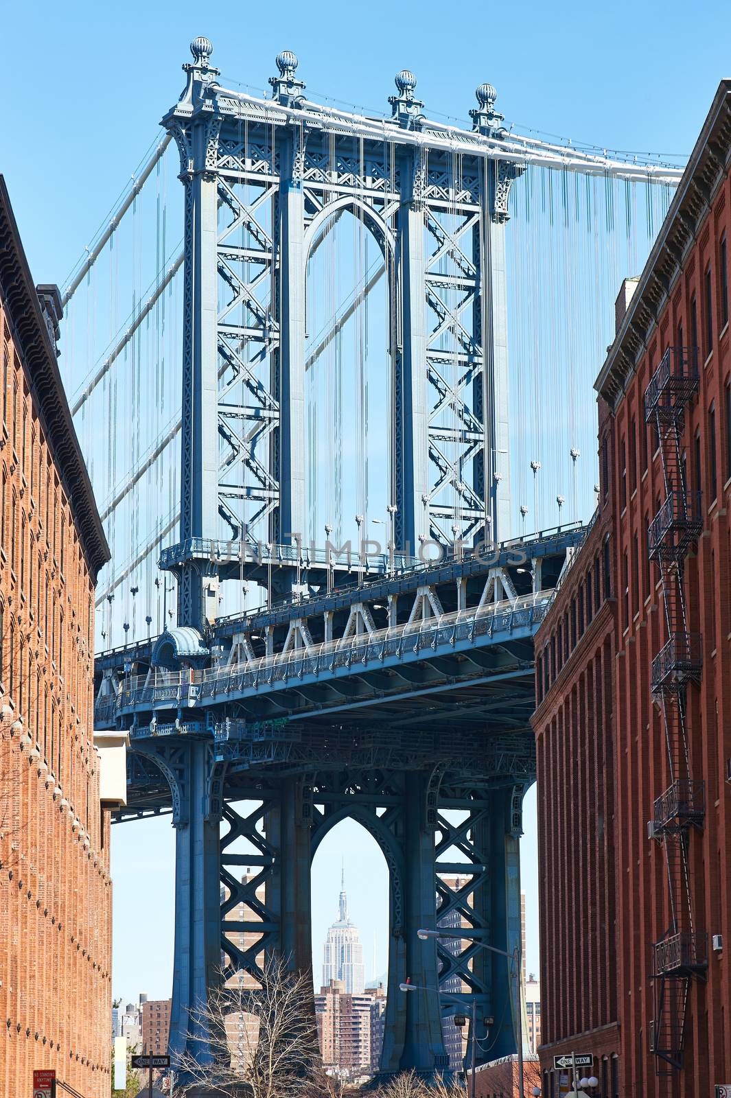 Famous view at Manhattan Bridge and Empire State Building from Brooklyn in New York City