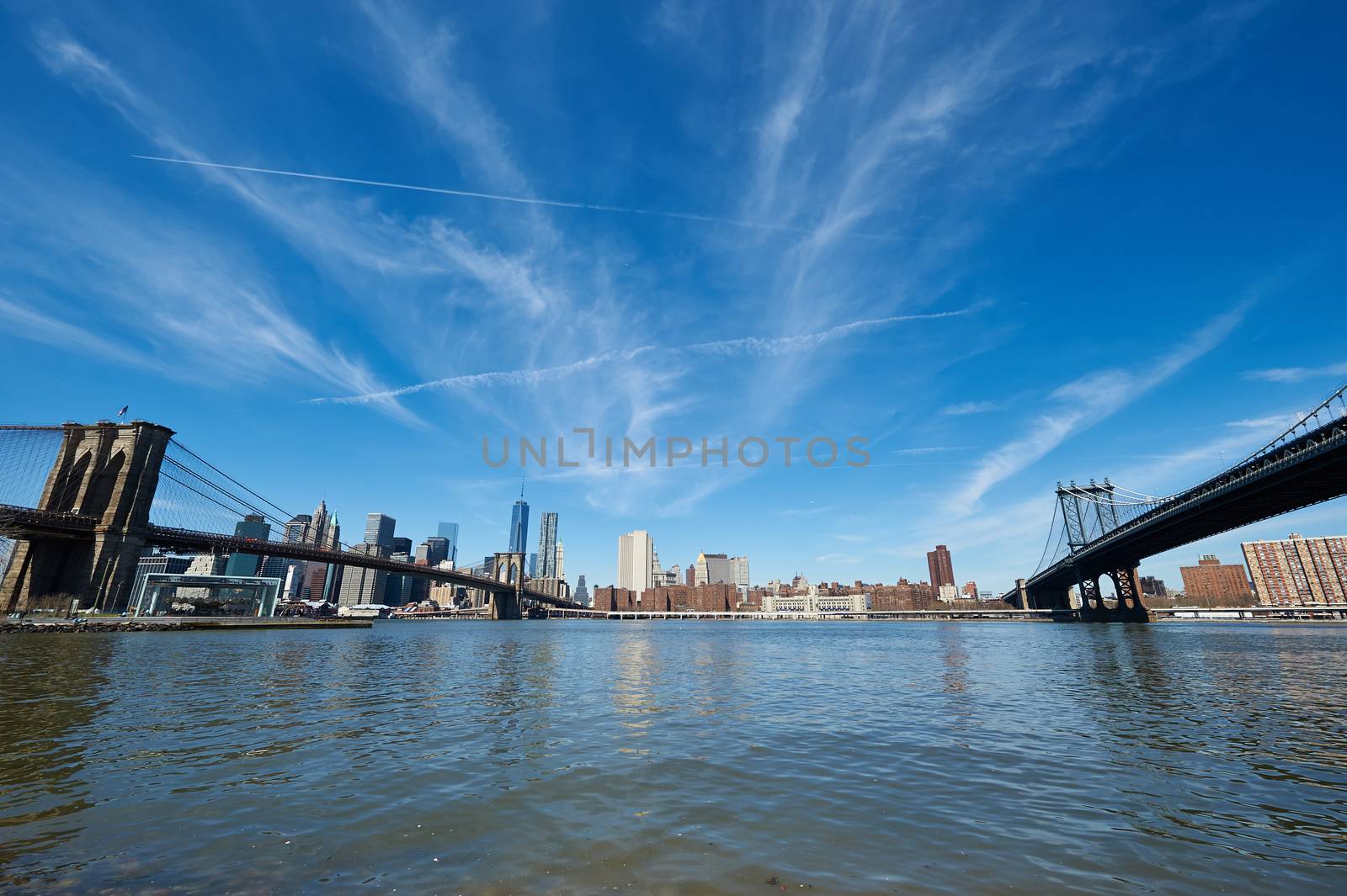 Manhattan skyline view from Brooklyn between Brooklyn Bridge and Manhattan Bridge in New York City