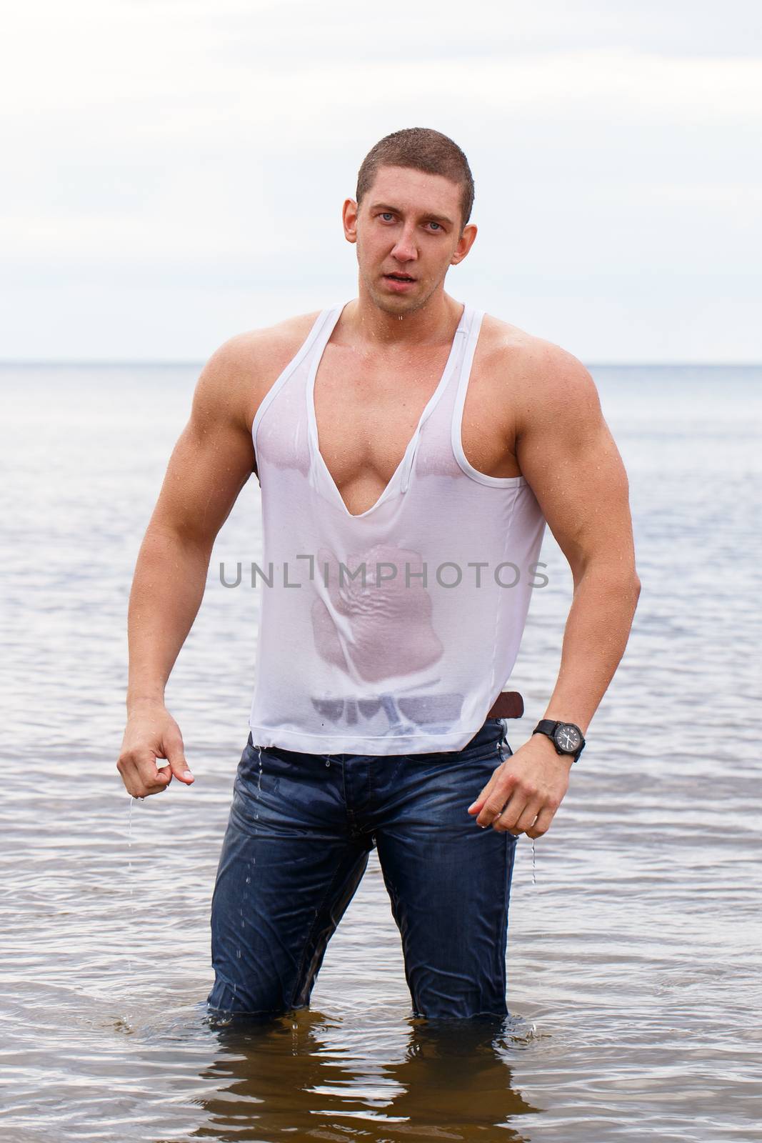 Sexy bodybuilder on the beach by rufatjumali