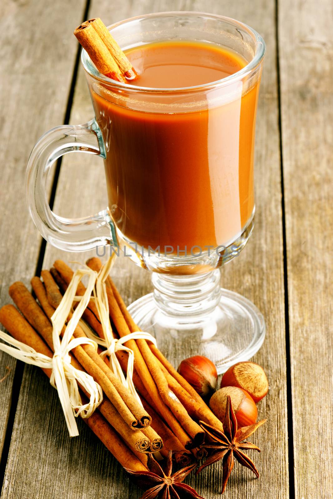 Glass of hot chocolate on wooden table