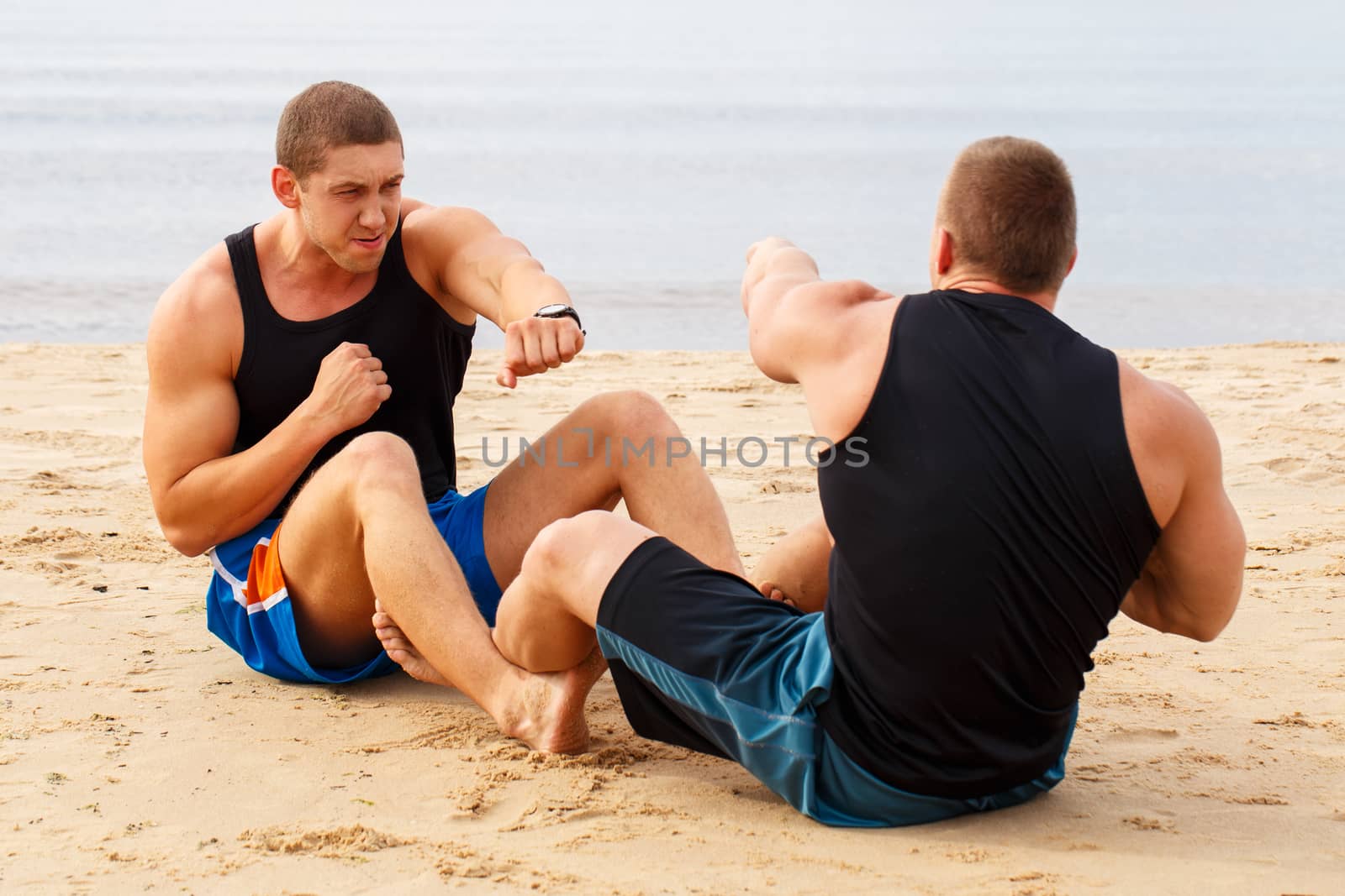 Bodybuilders on the beach by rufatjumali