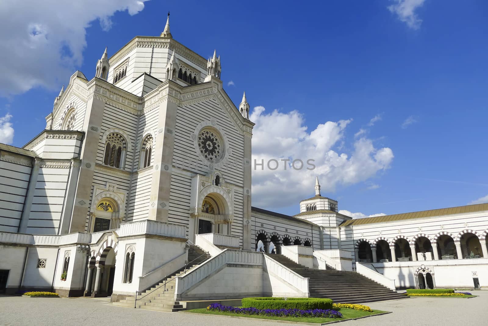 Frontal facade view of Cimitero Monumentale in a beautiful day with blue sky, Monumental Cemetery, Milan, Lombardy, Italy, Europe.