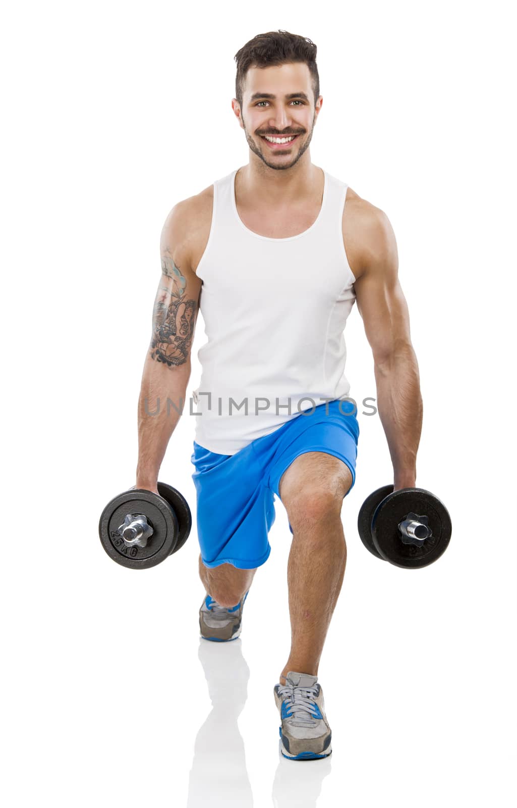 Portrait of a muscular man lifting weights, isolated over a white background