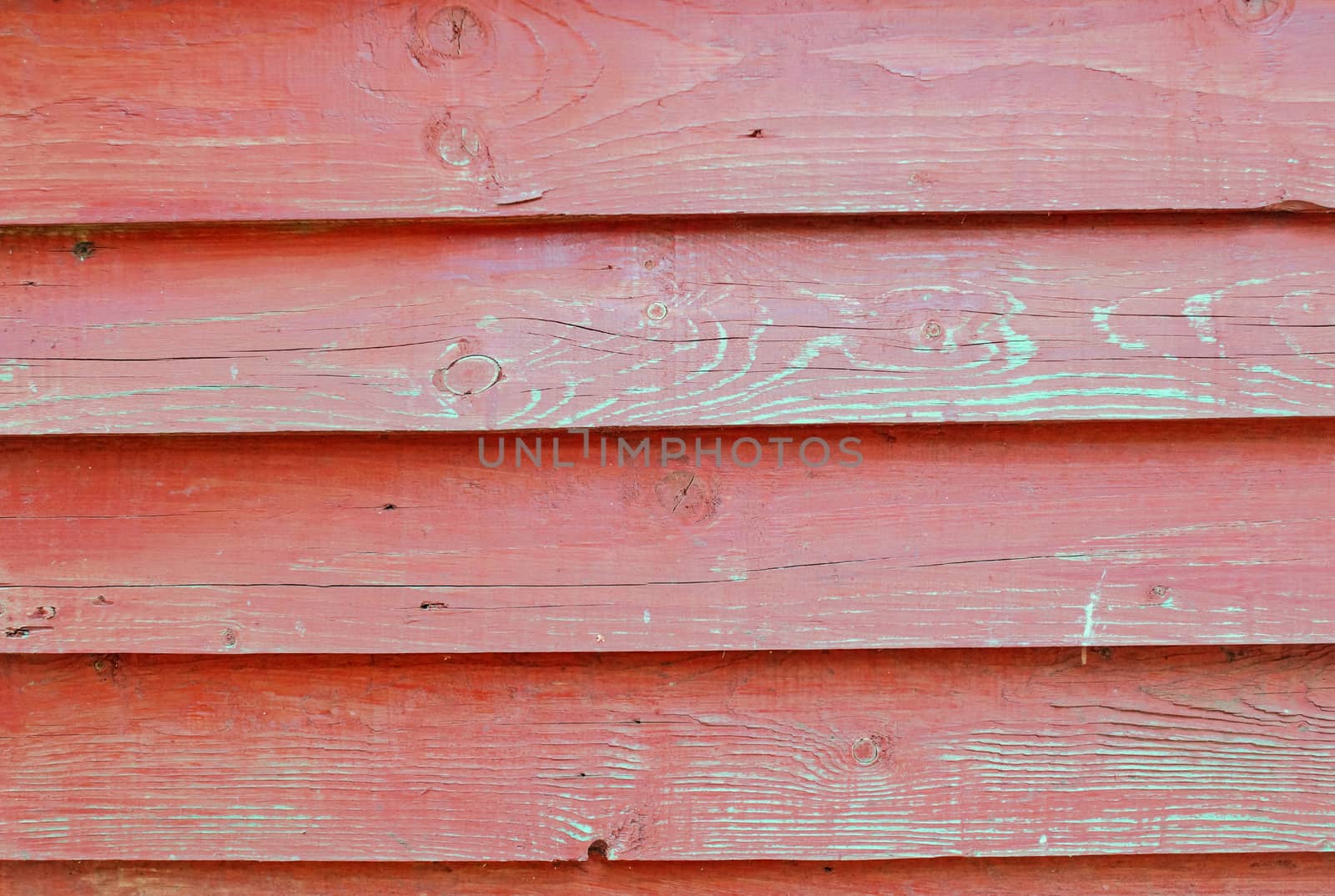 Texture of wall of -red color boards with flaky paint