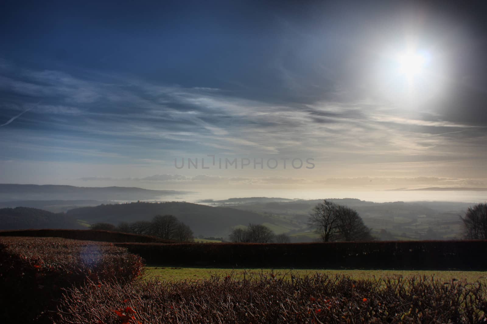 cloud or mist in a valley in exmoor national park by chrisga