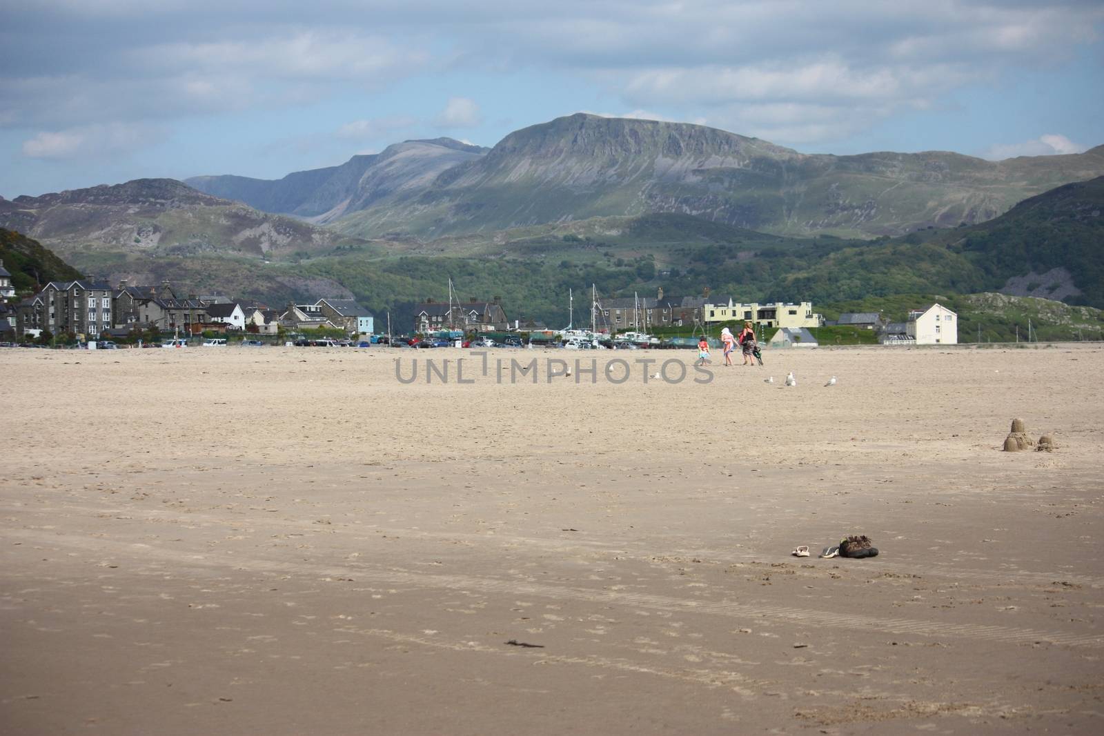 cadair idris mountain range looking down on barmouth beach