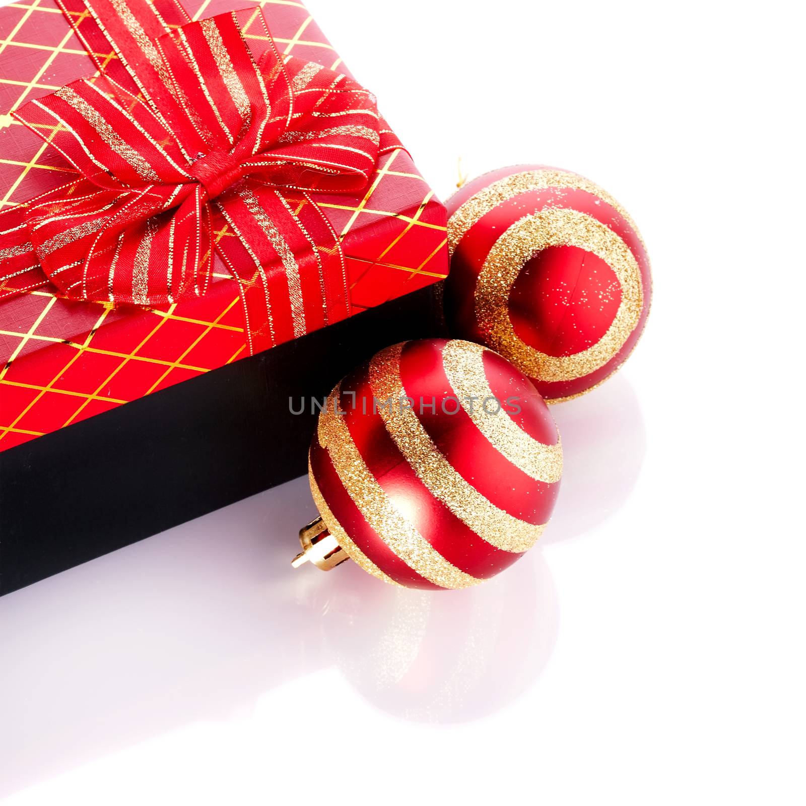 New Year's striped red balls and gift. by Azaliya