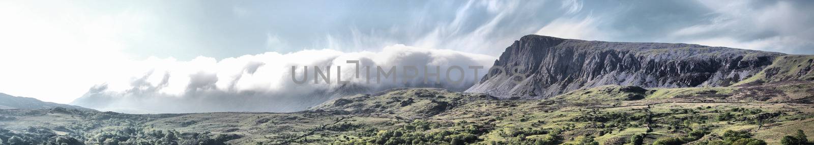 Stunning welsh mountains under a cloudy blue sky by chrisga