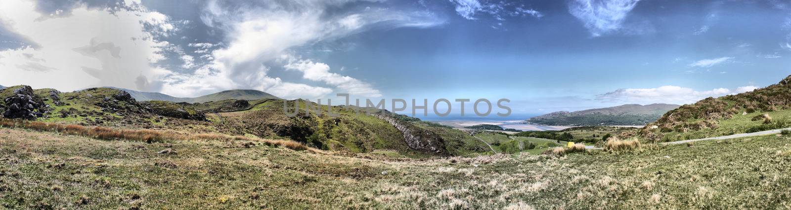 Stunning welsh mountains under a cloudy blue sky by chrisga