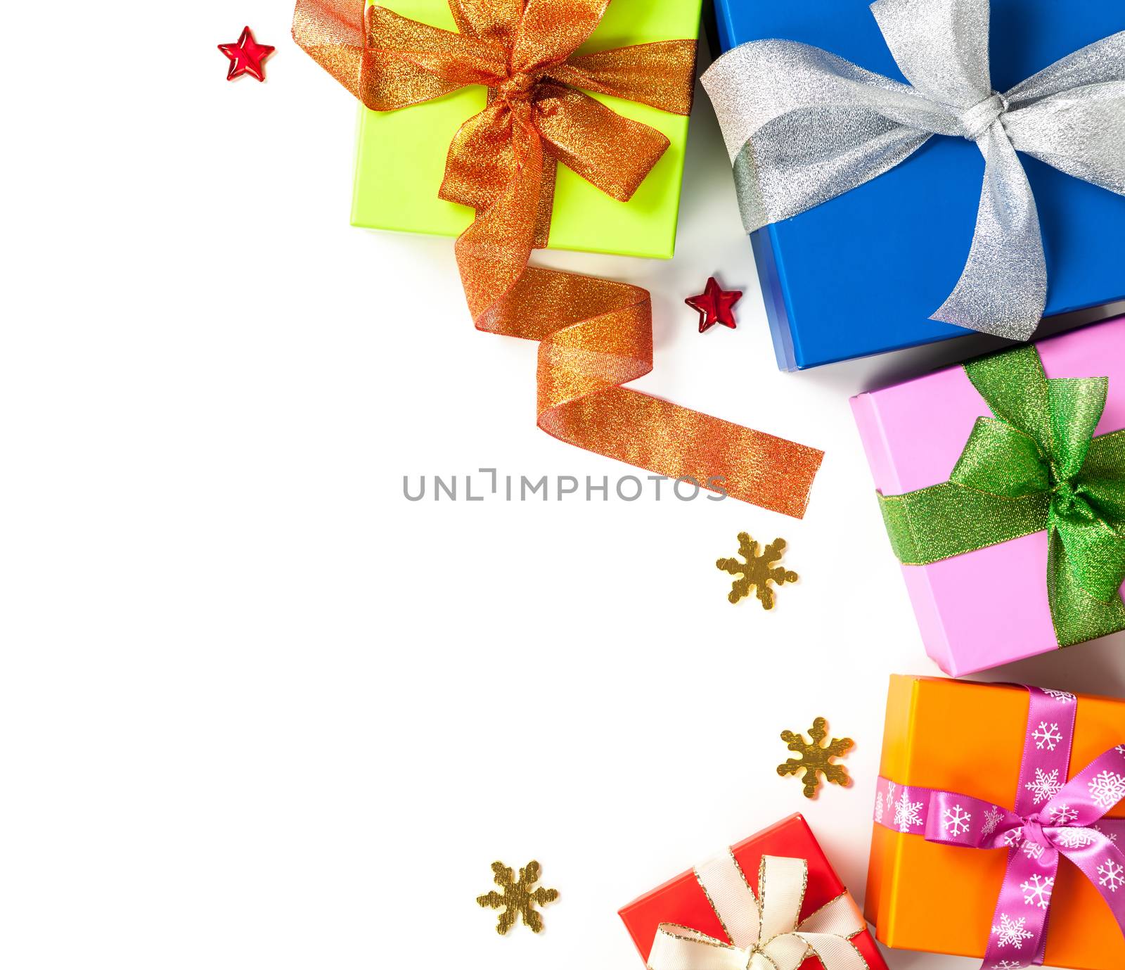 Gift boxes with bows on white background. Christmas composition with copy space. Top view