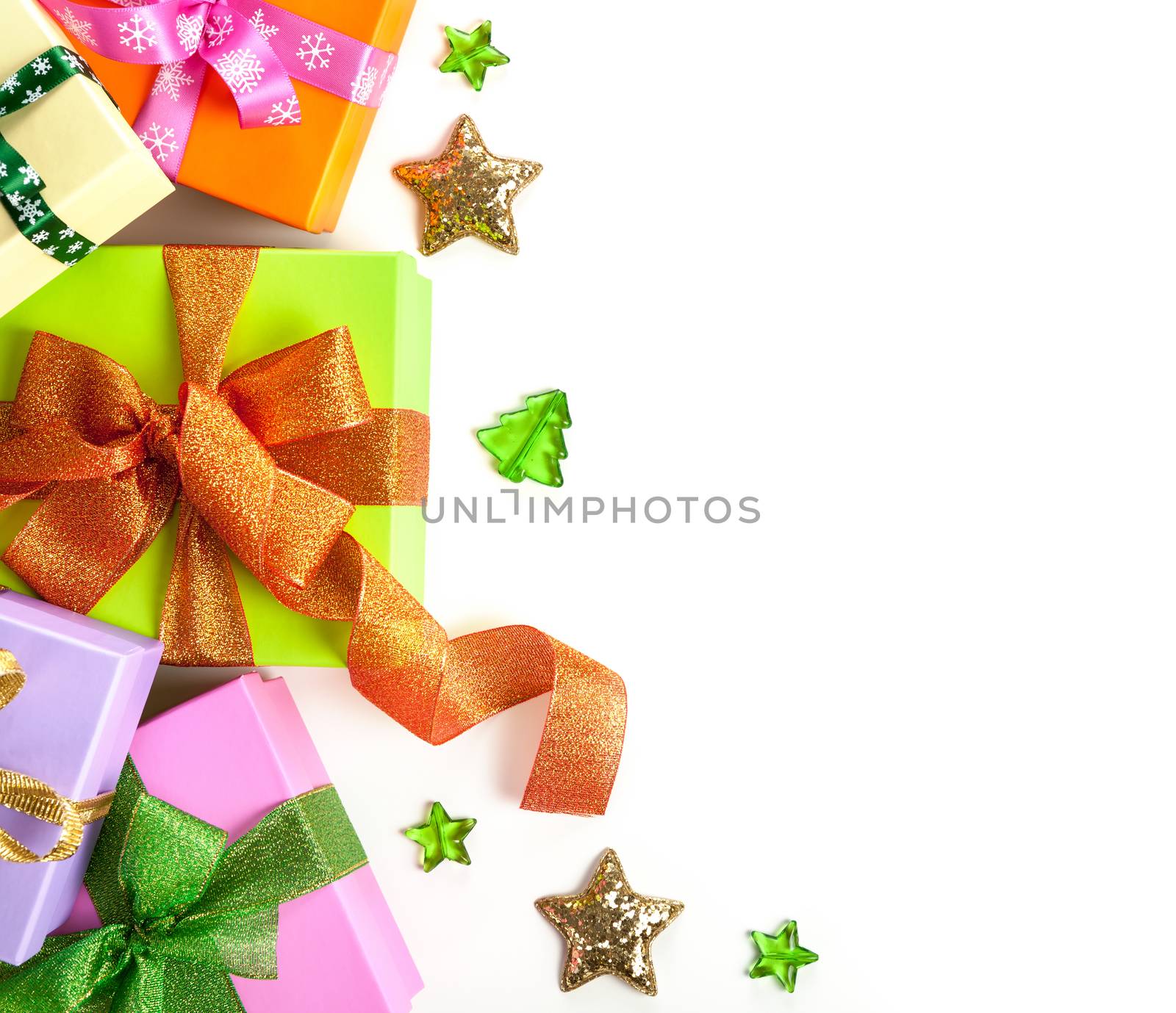 Gift boxes with bows on white background for Christmas. Top view. Copy space