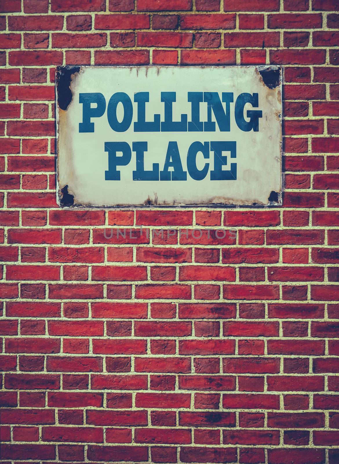 Retro Filtered Sign For An Election Polling Place Or Station On A Red Brick Wall