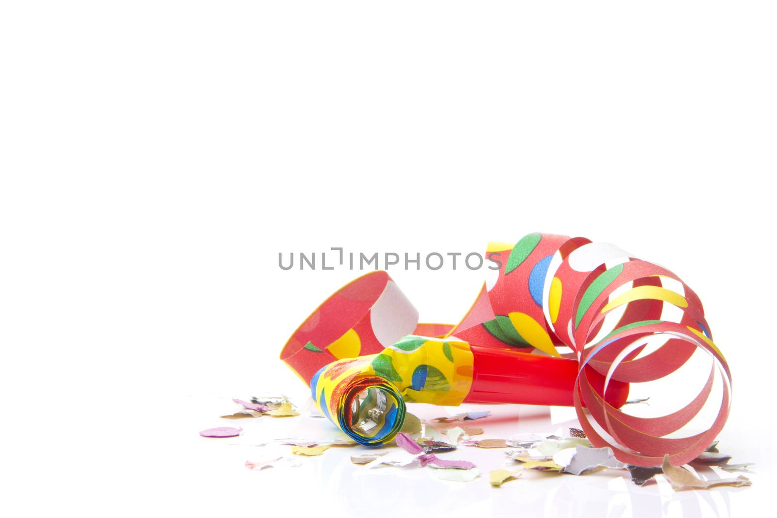 streamers and confetti as decoration for parties, sylvester with white background 