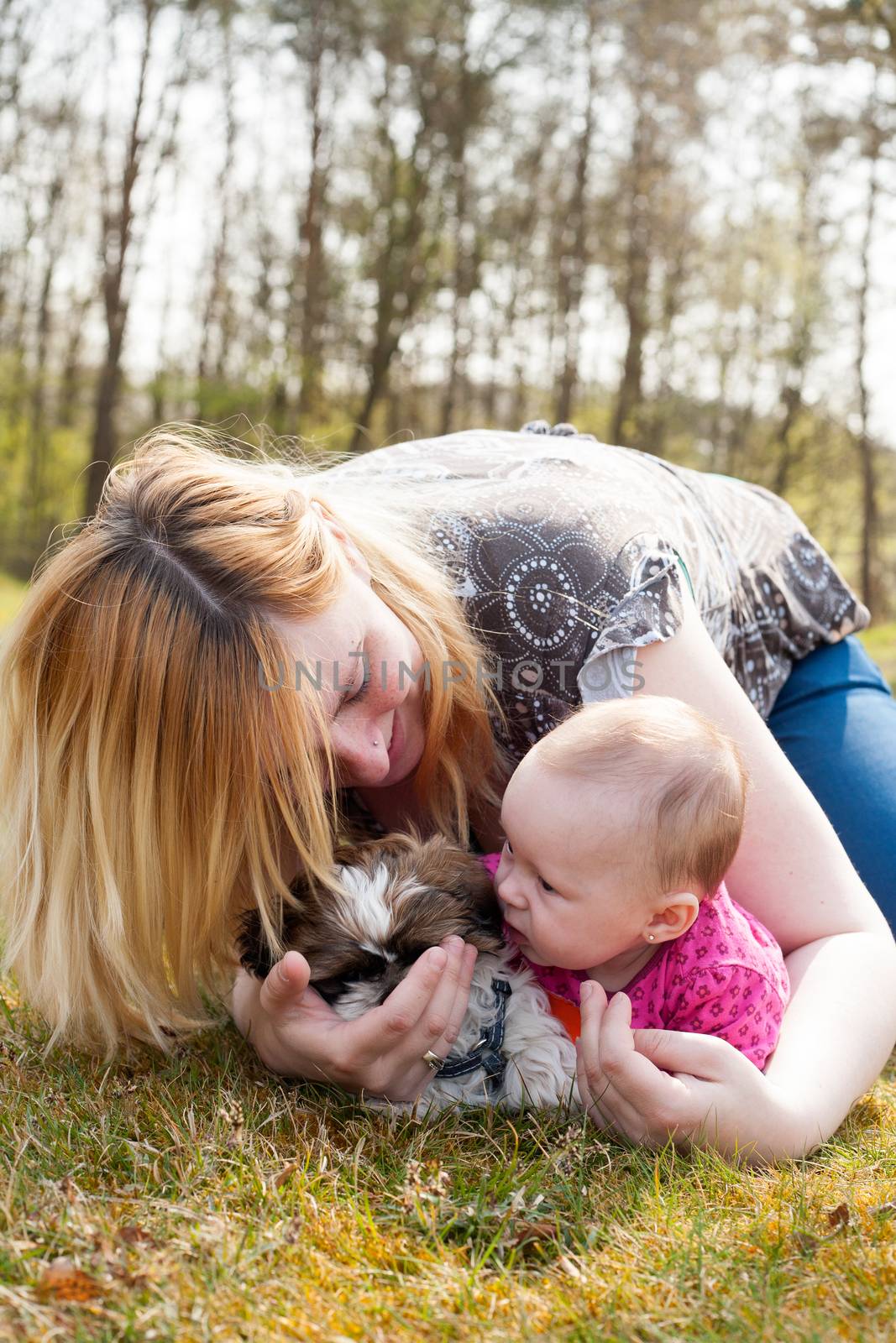 Mother is playing with puppy and baby by DNFStyle