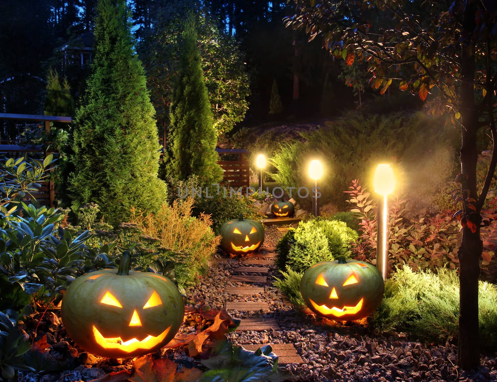 Illuminated home garden path patio lights with halloween pumpkin lanterns