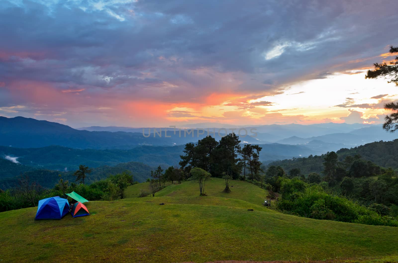 Sunset over hills at campsite on the high mountain in Huai Nam Dang national park, Chiang Mai and Mae Hong Son province of Thailand