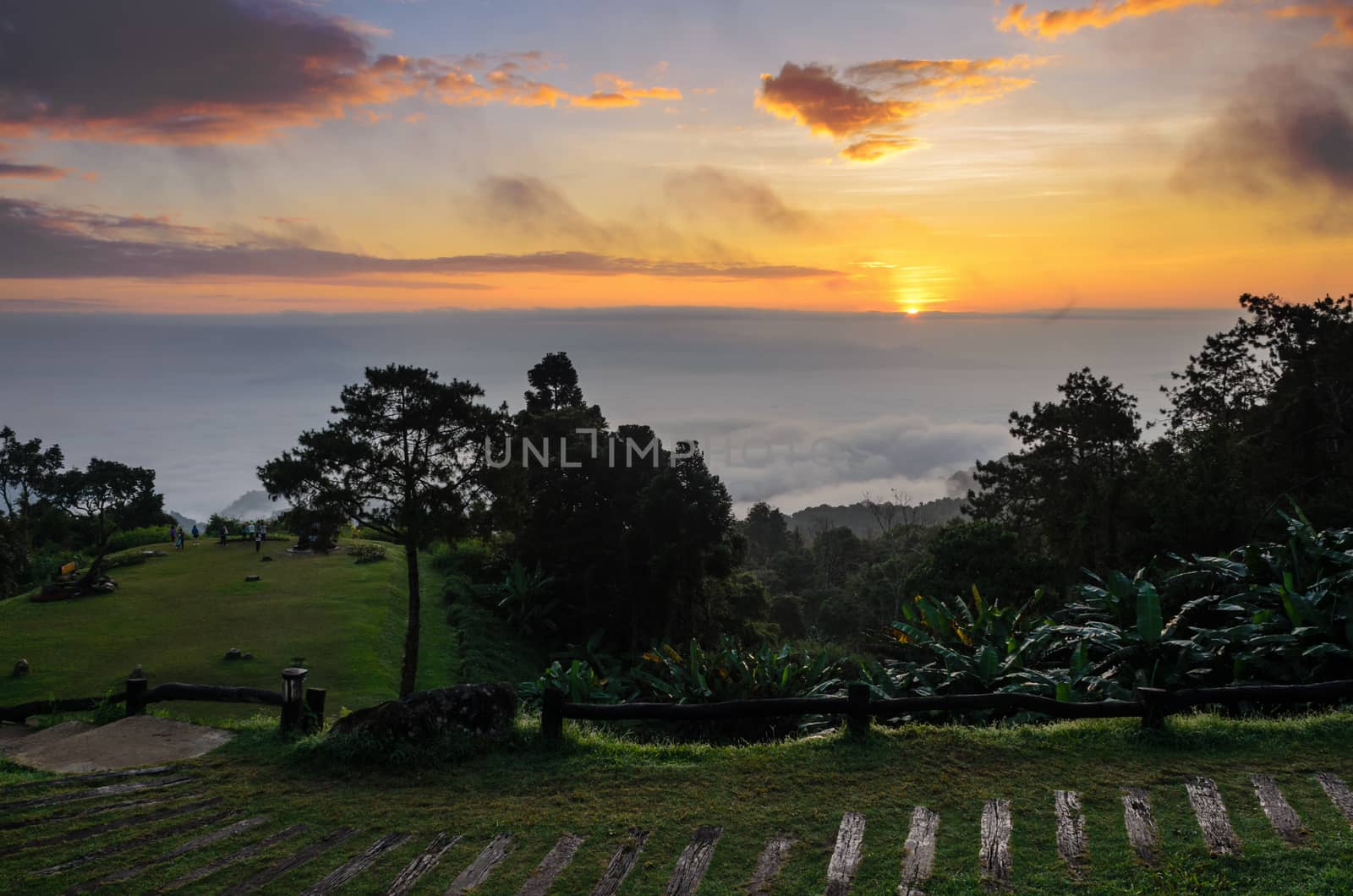 Colorful sunrise above the clouds from high mountain at viewpoint Huai Nam Dang national park in Chiang Mai and Mae Hong Son province of Thailand