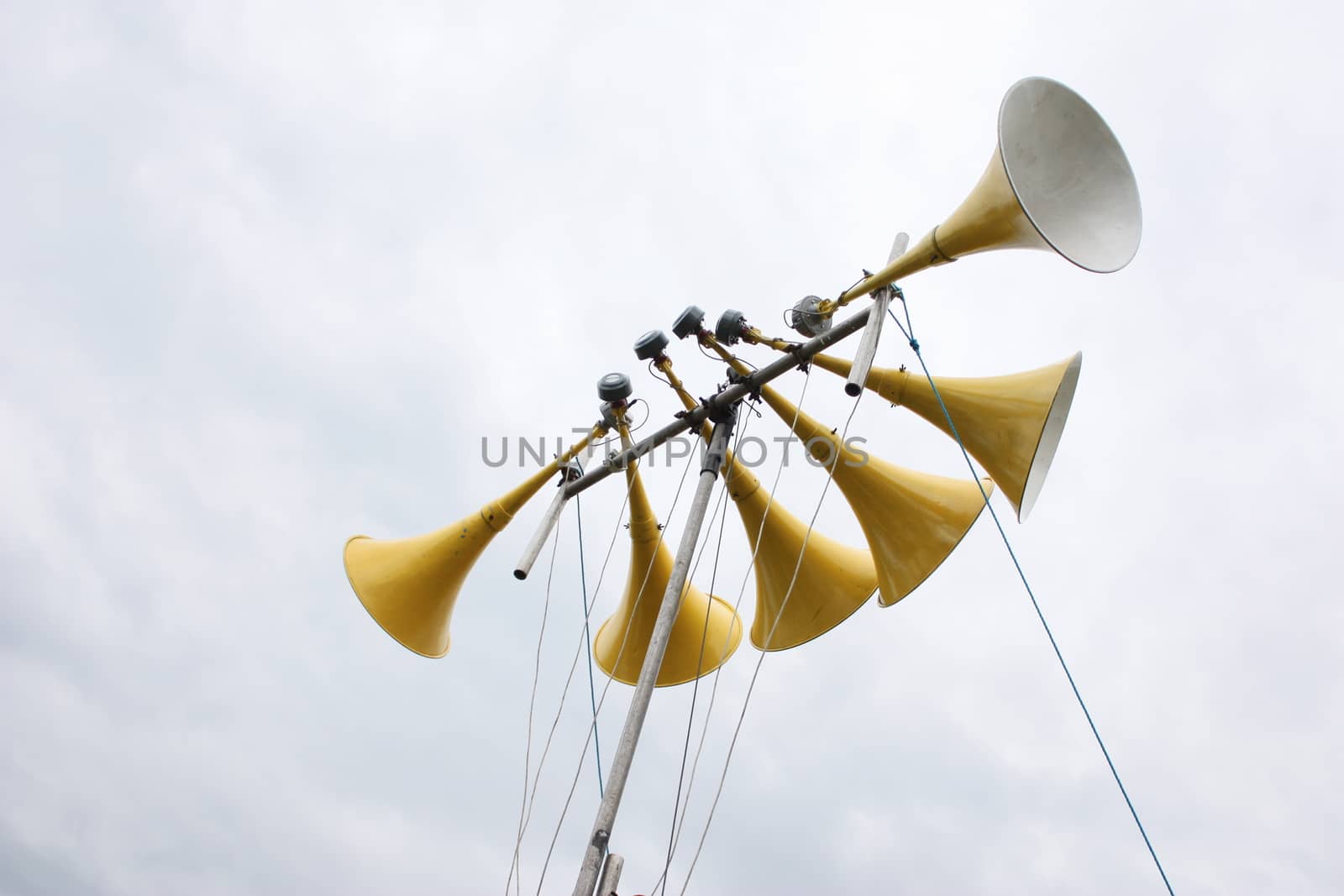 large yellow loudspeaker system