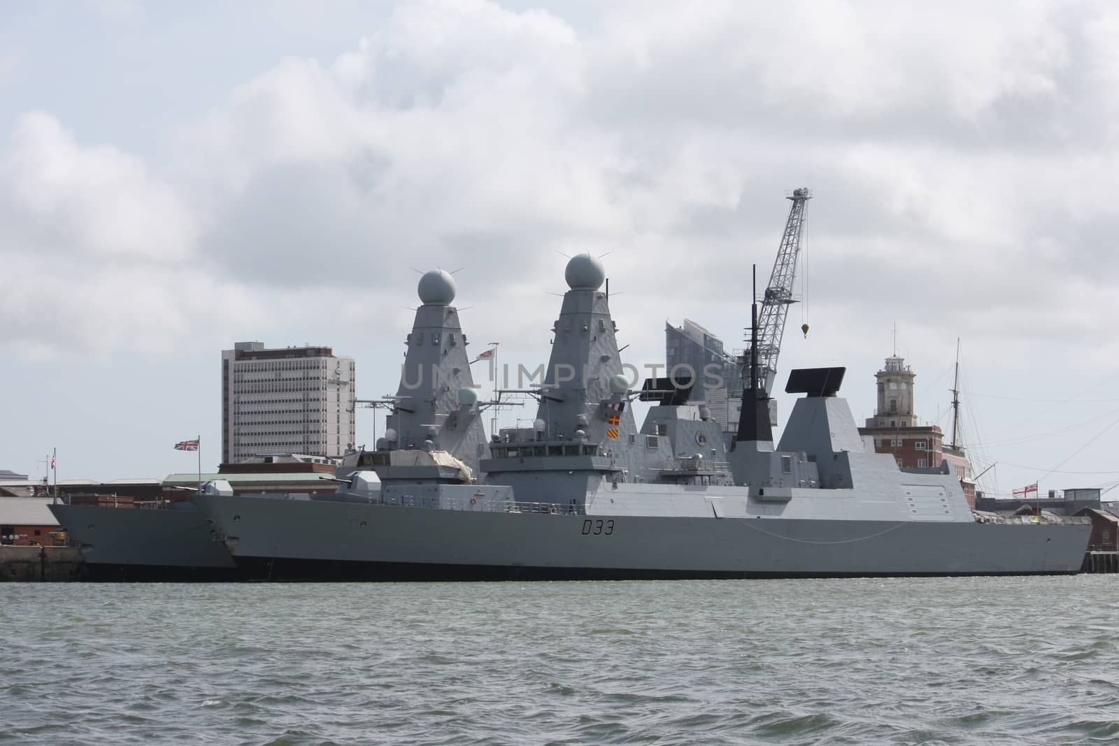 large grey warships moored in portsmouth harbour by chrisga