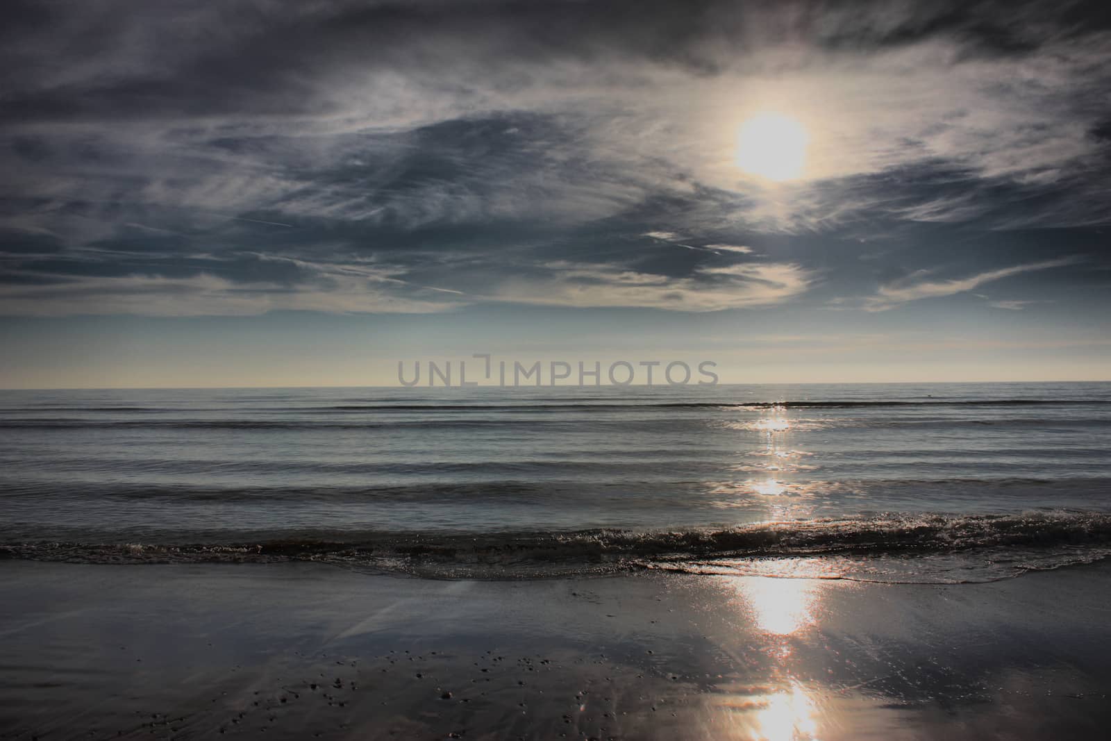 Beautiful sunset over a sandy beach by chrisga