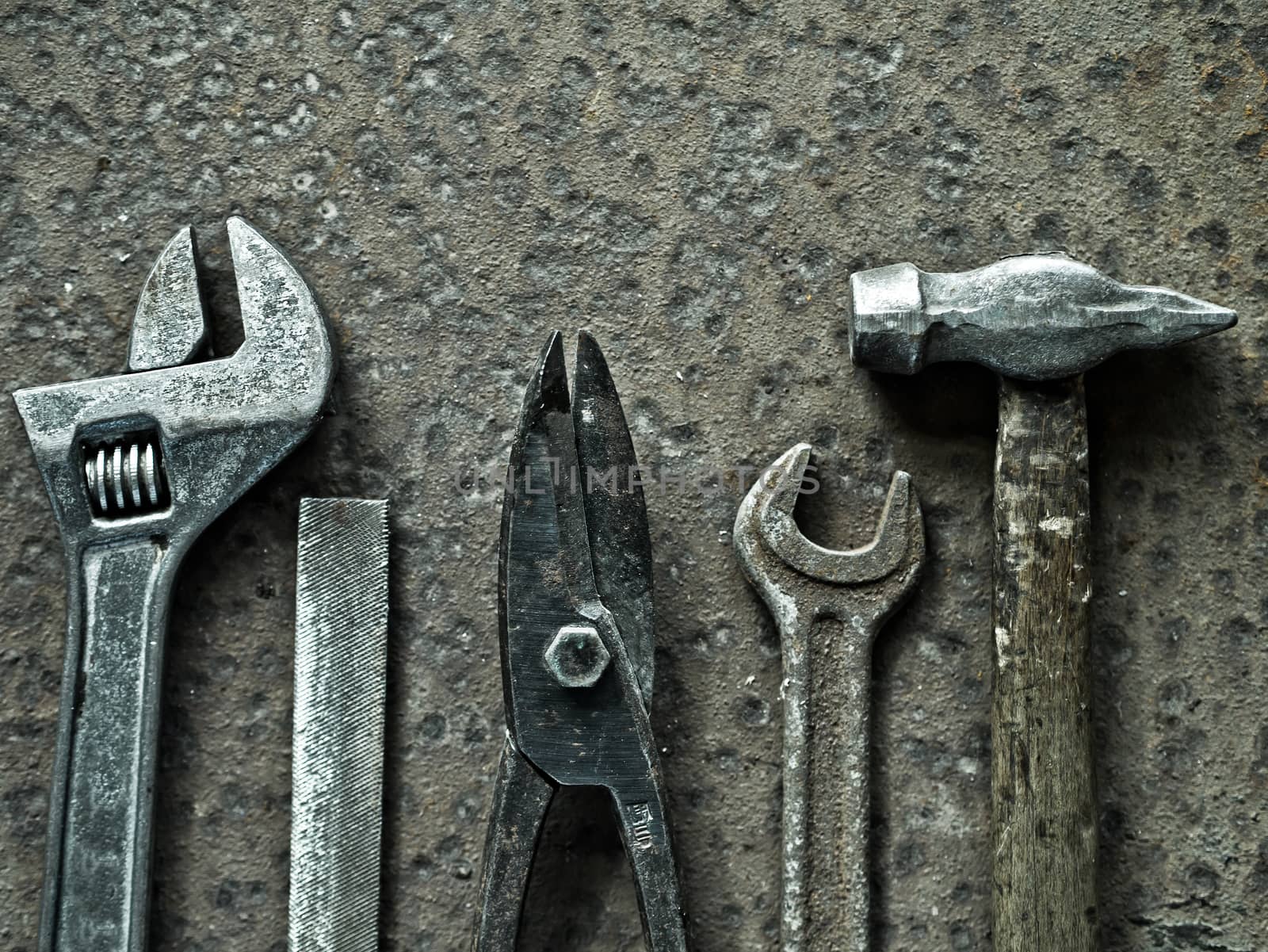 Old tools on a rusty metal background