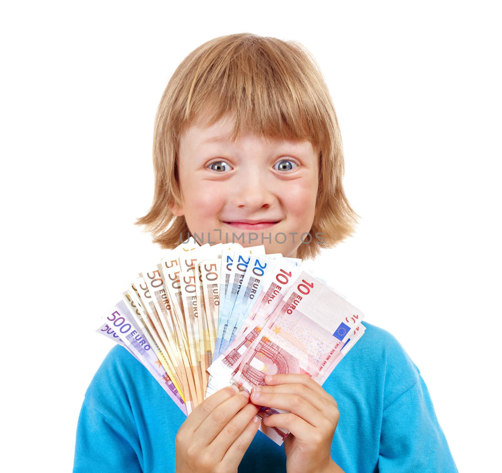 BOY WITH BLOND HAIR HOLDING UP EURO BANKNOTES.