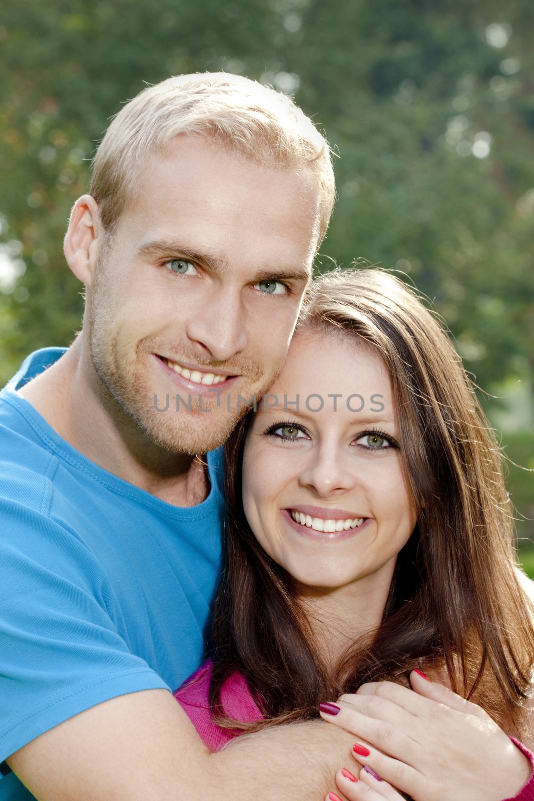 portrait of a happy young couple smiling.