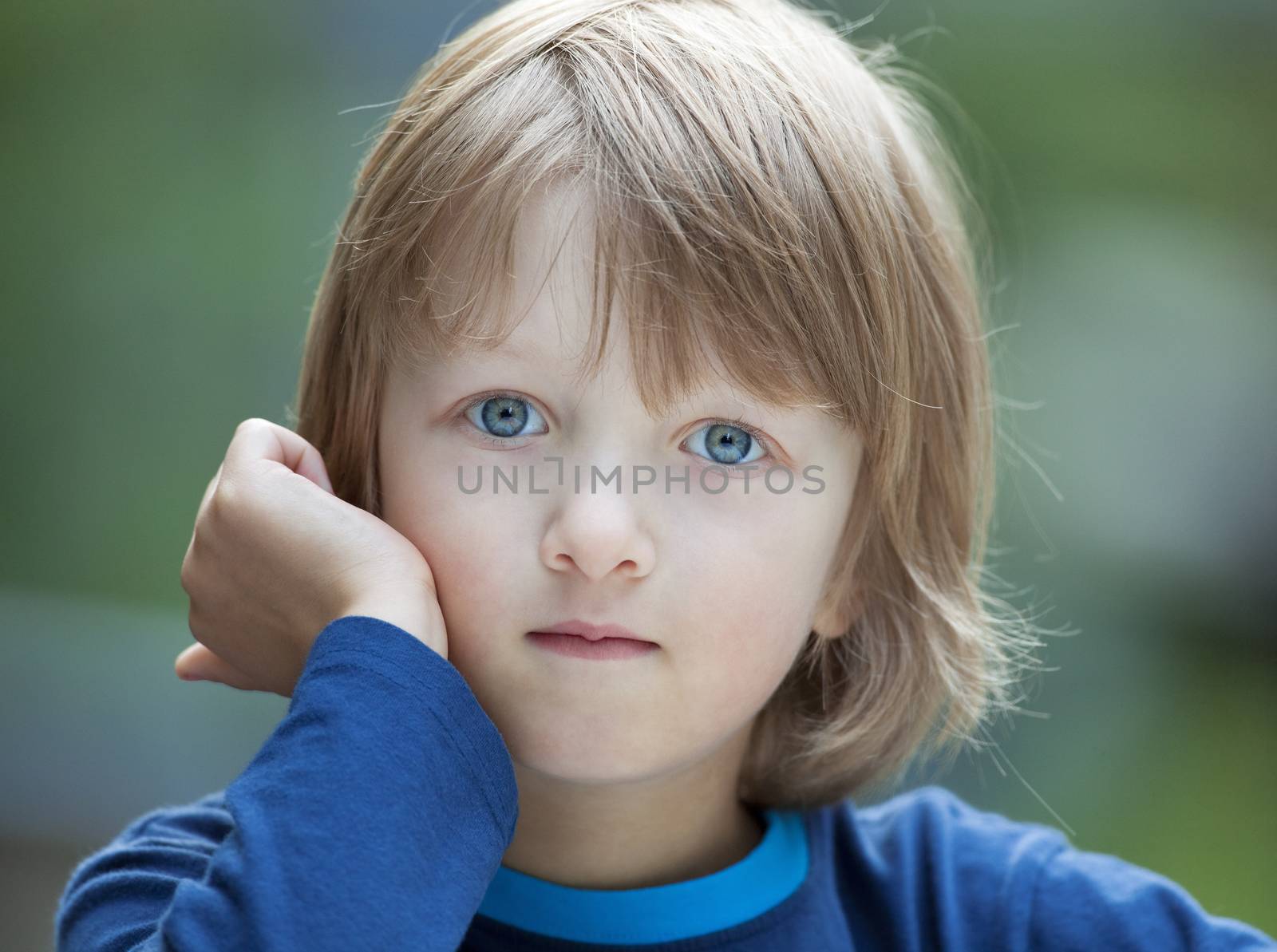 Portrait of a Beatiful Boy with Blond Hair