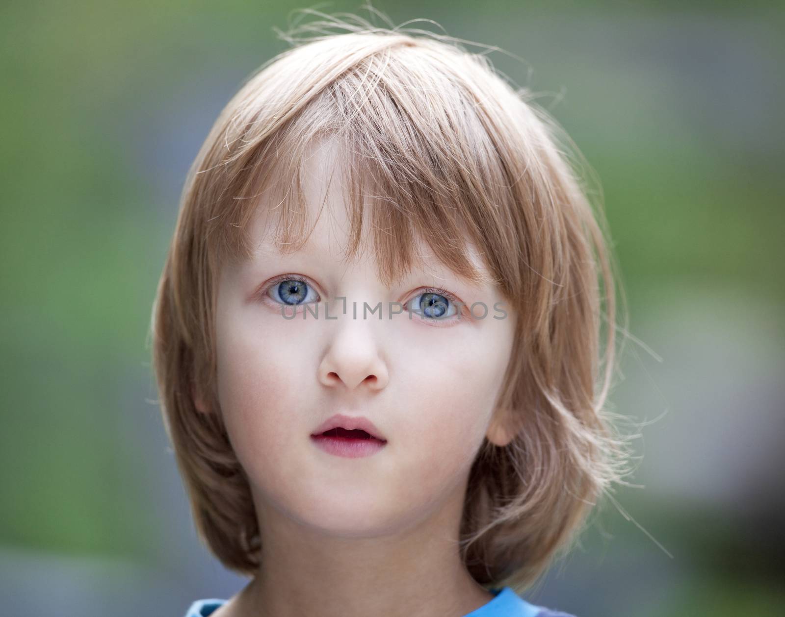 Portrait of a Beatiful Boy with Blond Hair