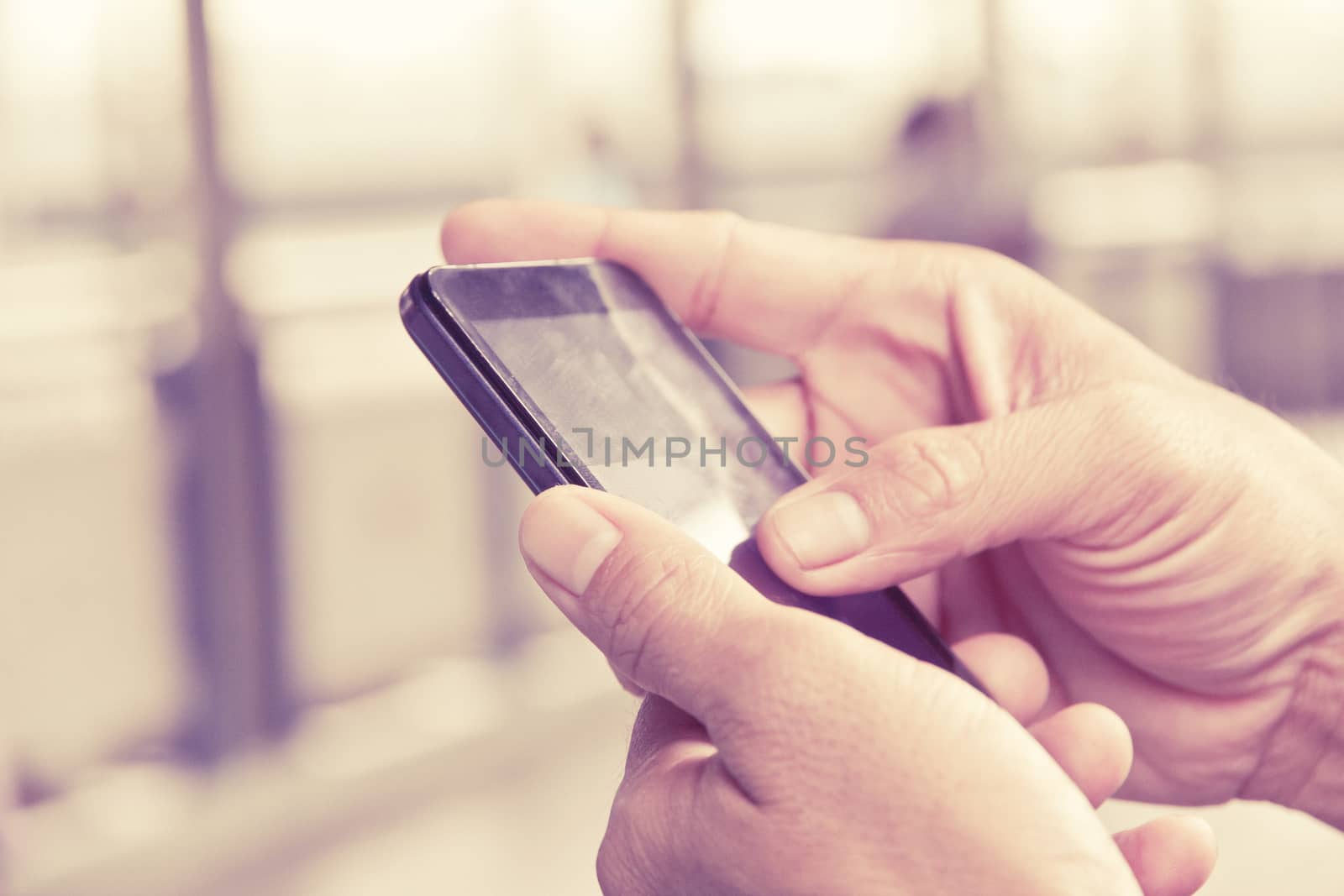 close up image of man checking his phone