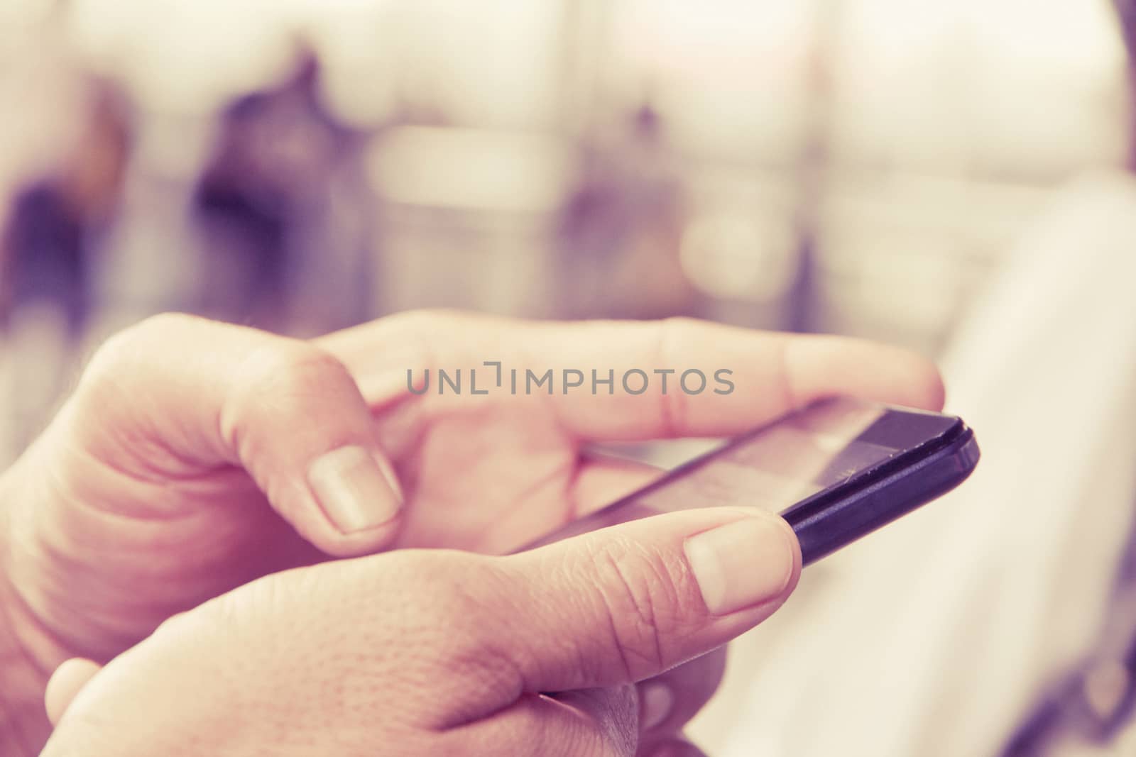 close up image of man checking his phone