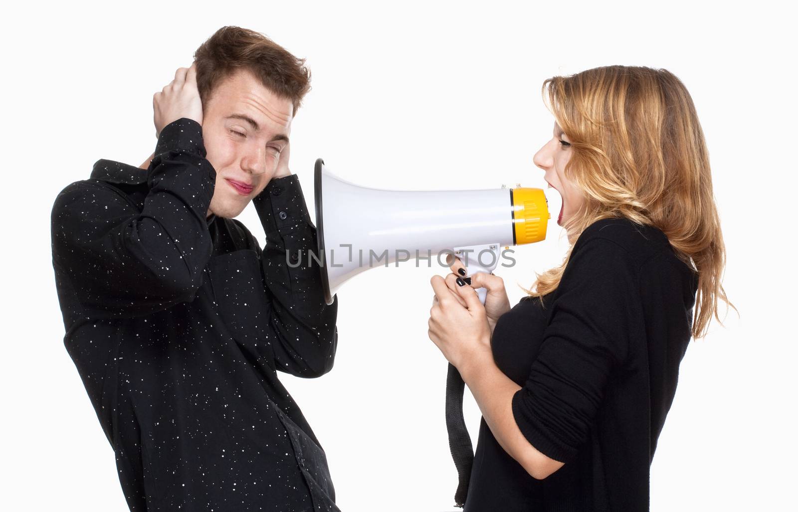 angray girlfriend screaming in megaphone, boyfriend covering his ears