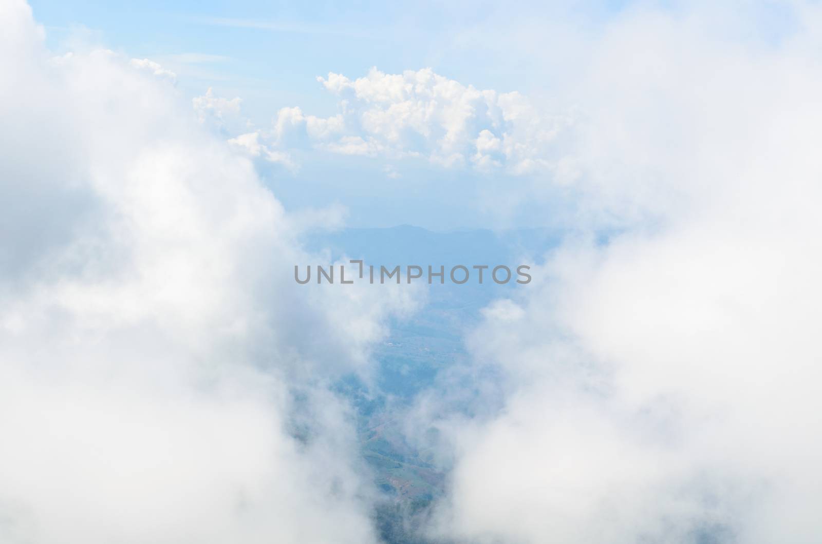 High angle view of the sky surrounded by clouds.
