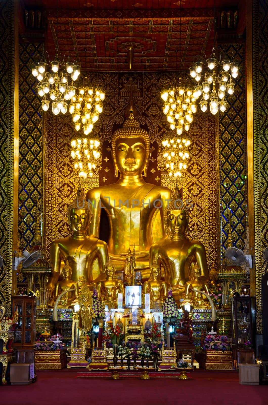 Buddha statue in the chapel of Wat Phra That Hariphunchai temple at Lamphun Province Thailand