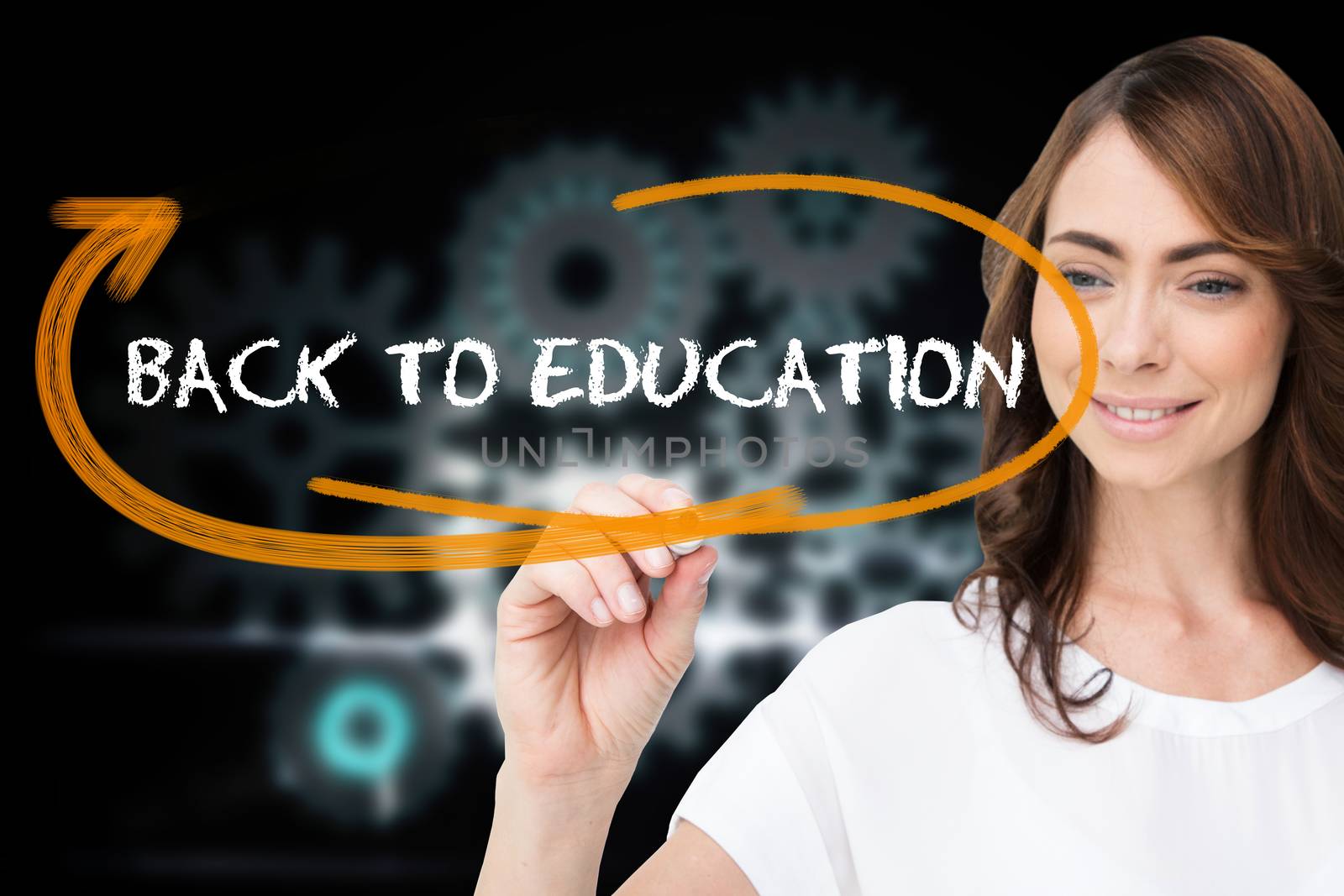 Businesswoman writing the words back to education against cogs and wheels graphic